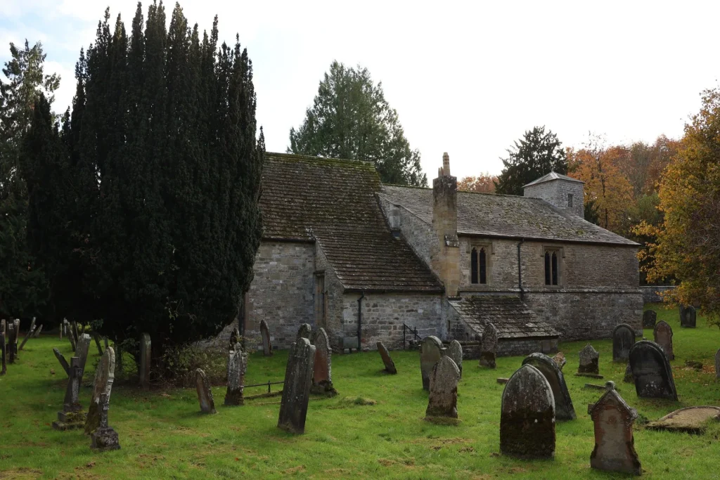 Church yard with various gravestones in the foreground